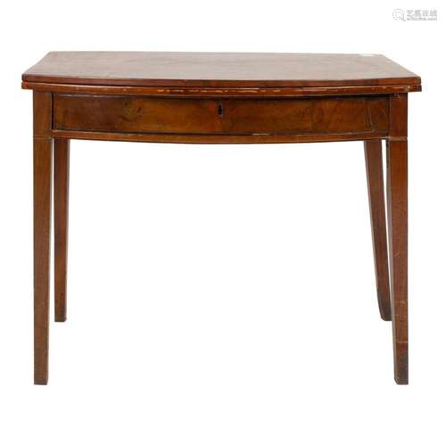 A Federal flip top demilune table executed in mahogany