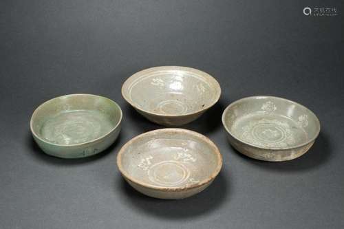 Four Korean celadon glazed dishes and bowl