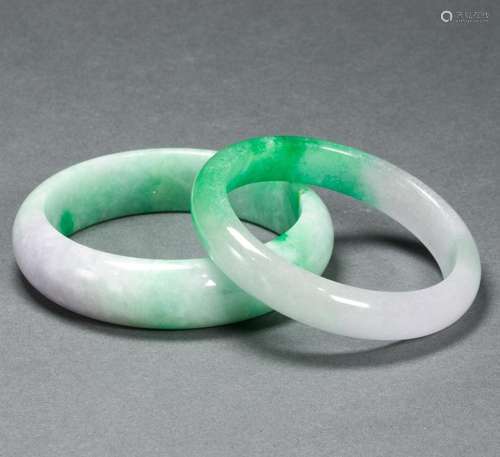 Two Chinese green jadeite bangles