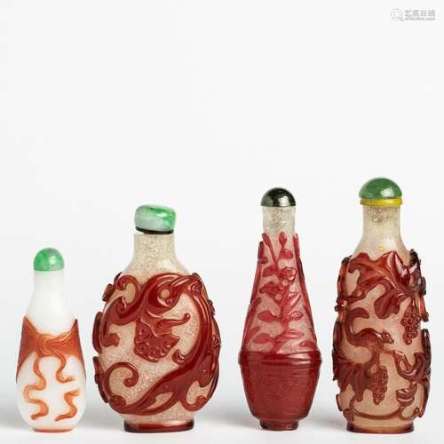 Four Chinese red overlay glass snuff bottles