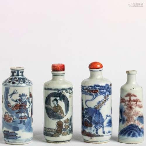 Four Chinese underglaze blue and copper red snuff bottles