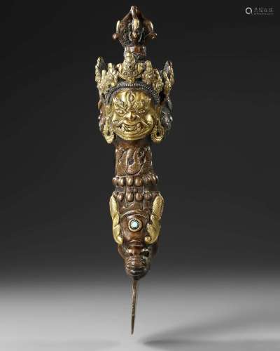 A BRONZE BUDDHIST PHURBA, POSSIBLY NEPALESE, EARLY 20TH CENT...