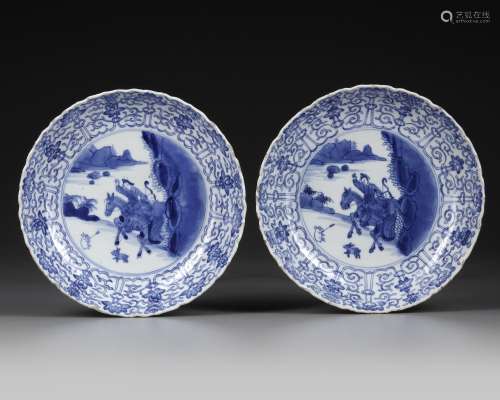 A PAIR OF CHINESE BLUE AND WHITE 'HUNTING' DISHES, KANGXI PE...