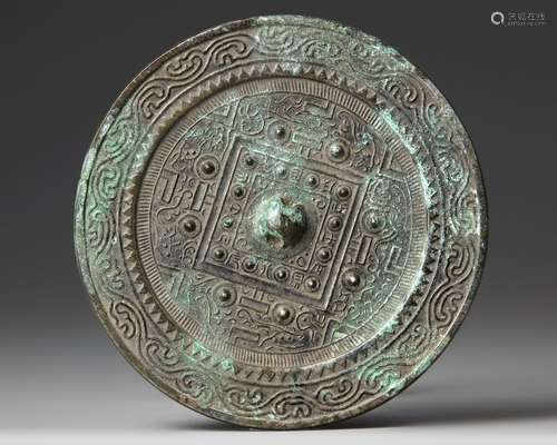 A CHINESE CIRCULAR 'TLV' BRONZE MIRROR,  XIN/EARLY EASTERN H...