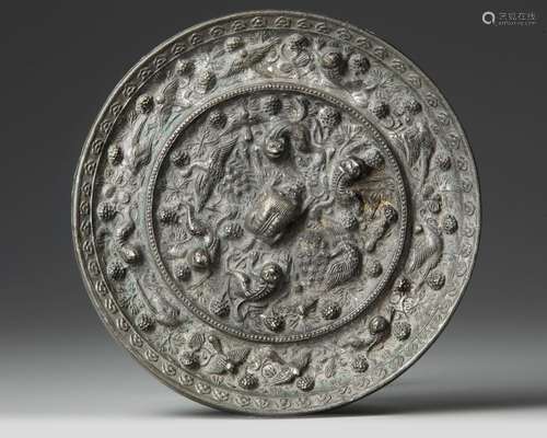 A CHINESE CIRCULAR BRONZE MIRROR, TANG DYNASTY (618-907 AD)