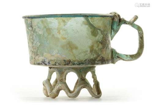 AN APPLIED GLASS FOOTED CUP, PERSIA, 9TH CENTURY