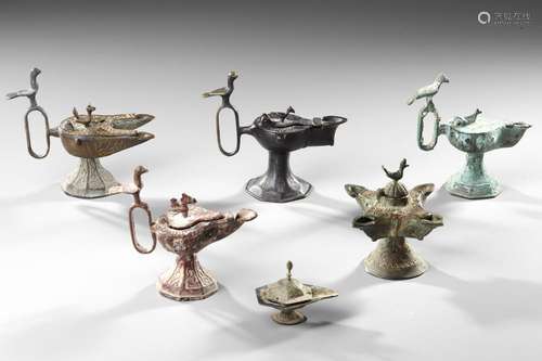 SIX PERSIAN BRONZE OIL LAMPS, SELJUK 12TH-13TH CENTURY AND L...