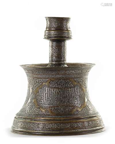 A LARGE MAMLUK STYLE SILVER INLAID BRASS CANDLESTICK, 19TH C...