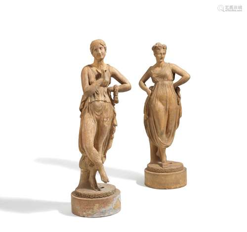 Two large sculptures of female dancers