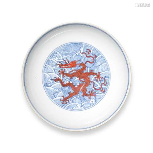 An iron-red and underglaze-blue 'dragon' dish, Seal mark and...