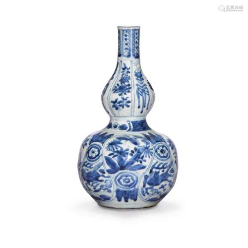 A moudled blue and white double-gourd vase, Ming dynasty, 17...
