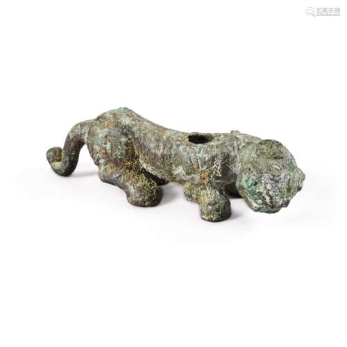 An archaic bronze figure of a crouching tiger-form support, ...