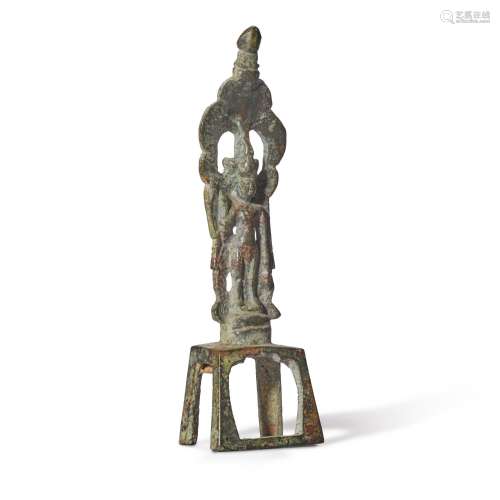 A miniature gilt-bronze figure of Bodhisattva Avalokitesvara...