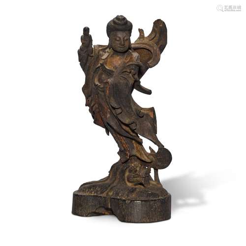 A carved wood figure of a deity, Ming dynasty