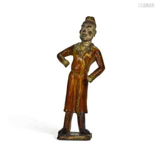 An amber-glazed pottery figure of a groom, Tang dynasty