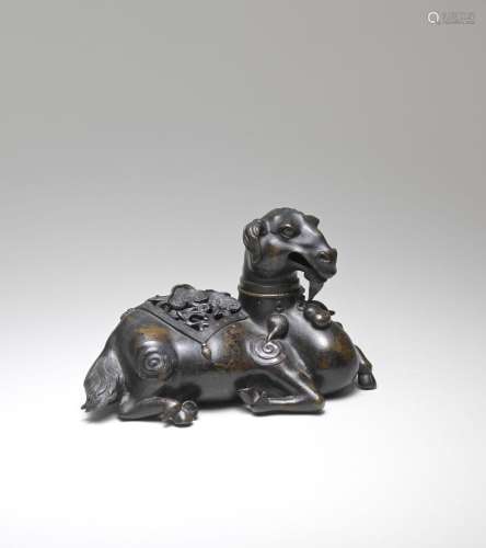 A RARE BRONZE GOAT-FORM RETICULATED INCENSE BURNER AND COVER...