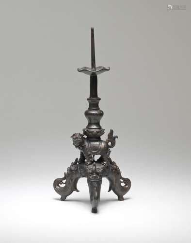 A BRONZE 'MYTHICAL BEAST' PRICKET CANDLESTICK  16th century