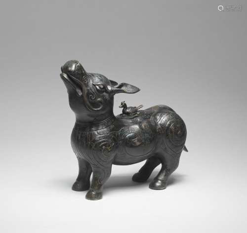 A RARE GOLD AND SILVER-INLAID BRONZE TAPIR-SHAPED VESSEL AND...