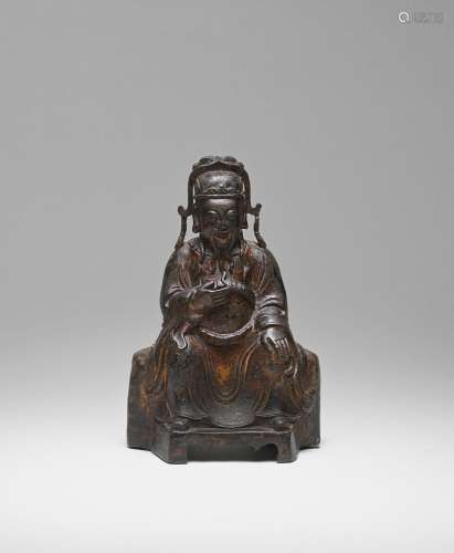 A GILT-LACQUERED BRONZE FIGURE OF AN OFFICIAL  Ming Dynasty