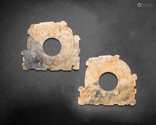 A PAIR OF ARCHAIC JADE NOTCHED-SHAPED DISCS, XUANJI Spring a...