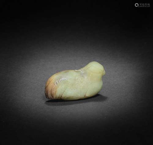 A YELLOW AND RUSSET JADE CARVING OF A BIRD Song Dynasty