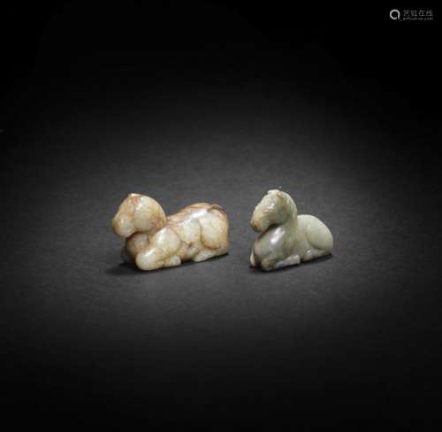 TWO PALE GREEN, GREY AND RUSSET JADE CARVINGS OF HORSES Yuan...