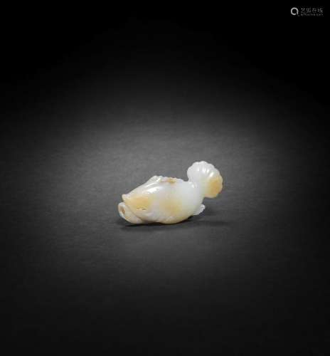 A WHITE AND RUSSET JADE CARVING OF A FISH Ming Dynasty