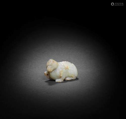 【Y】A PALE GREEN AND RUSSET JADE CARVING OF A MYTHICAL BEAST ...
