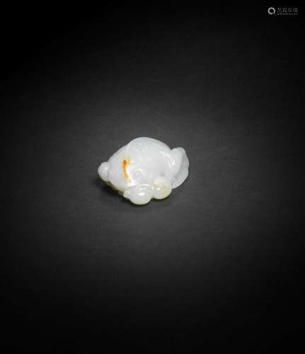 A WHITE AND RUSSET JADE CARVING OF A THREE-LEGGED TOAD Qianl...