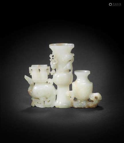 【*】A WHITE AND RUSSET JADE 'MYTHICAL ANIMALS AND VASES' GROU...