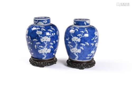 A pair of Chinese blue and white \'prunus\' ginger jars and ...