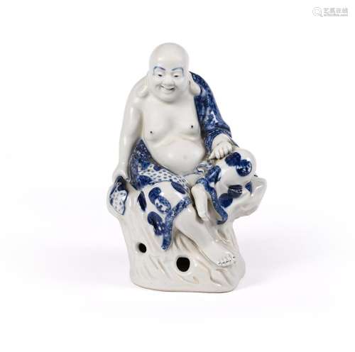 A Chinese blue and white figure of a seated Luohan