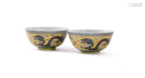 A pair of Chinese yellow-ground Famille Rose \'Dragon\' bowl...