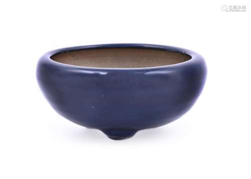 A small Chinese blue-glazed tripod censer
