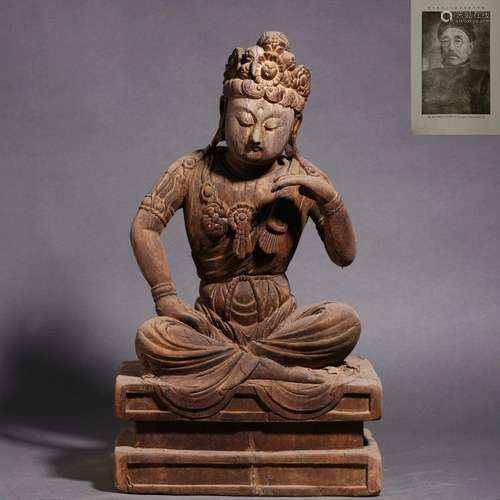 A carved wooden bodhisattva