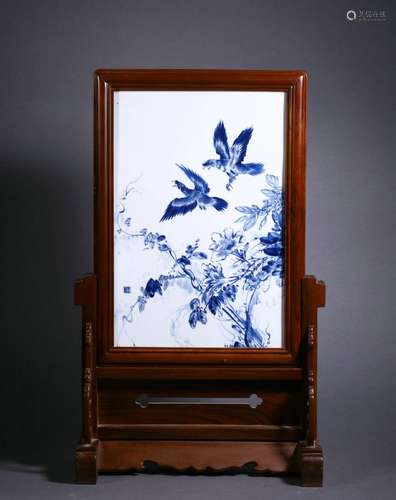 A blue and white flower and bird plaque