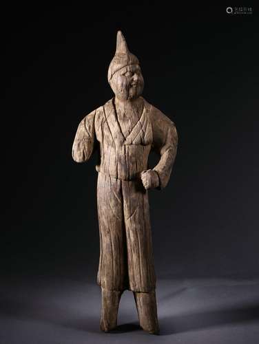 A carved wooden standing figure