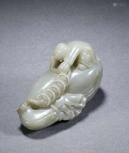 A carved jade kid