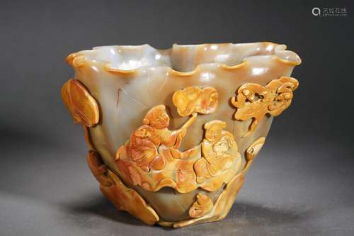 A carved agate figural story cup