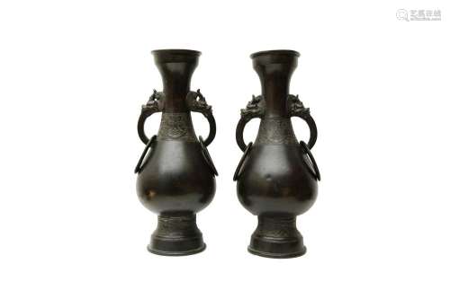 A PAIR OF CHINESE BRONZE TWIN-HANDLED VASES 明 銅瑞獸活耳瓶一...