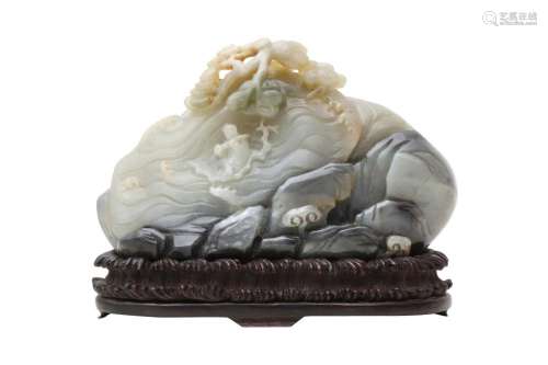 A CHINESE PALE CELADON AND GREY JADE 'MOUNTAIN' CARV...