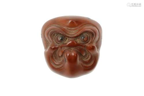 A JAPANESE WOOD NETSUKE OF A MASK