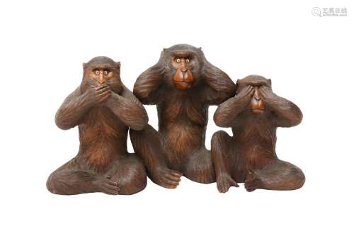 A JAPANESE WOOD 'THE THREE WISE MONKEYS' OKIMONO