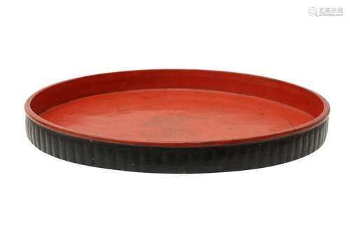 A LARGE BURMESE RED AND BLACK LACQUER TRAY OFFERED ON BEHALF...