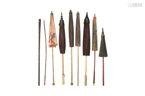 SEVEN BURMESE BAMBOO PARASOLS AND TWO LACQUERED WALKING STIC...