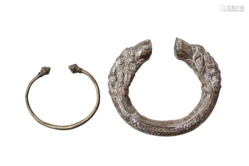 TWO NEPALESE WHITE-METAL BRACELETS OFFERED ON BEHALF OF PROS...