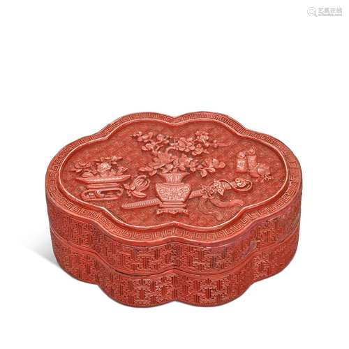 A small carved cinnabar lobed lacquer box and cover, Qing dy...