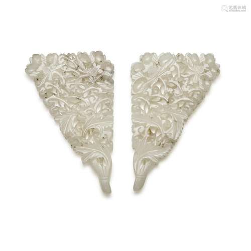 A pair of reticulated celadon jade ornaments, 19th / 20th ce...