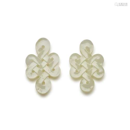 A pair of small white jade 'knots' carvings , 19th /...