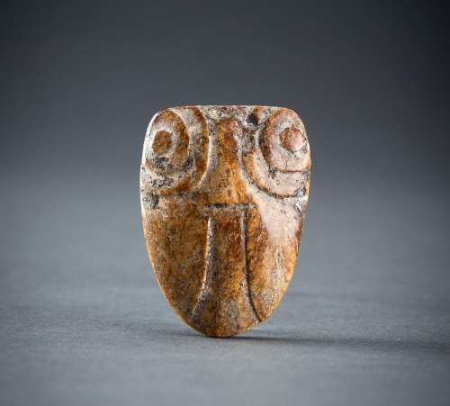 AN ARCHAISTIC AMBER JADE PENDANT OF A CICADA, QING DYNASTY O...